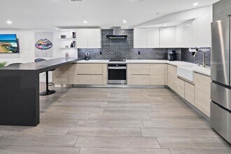 Building Photo - Live in one of San Diego’s most desirable locations in This award-winning architectural gem, "7 o...