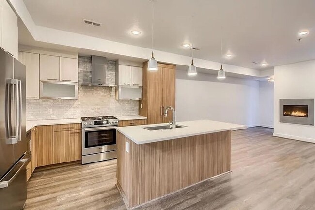 Building Photo - Modern LoHi Living with Rooftop Deck & City Views!!