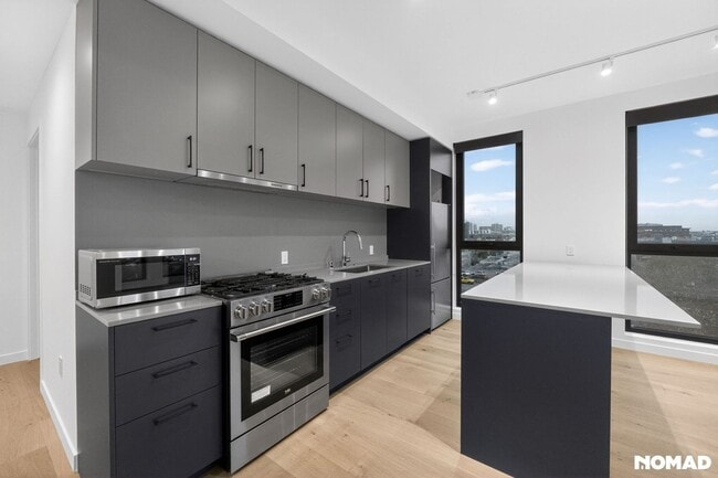 Building Photo - Act Fast: Luxury SoMa Corner Unit w/ EV Parking & Views