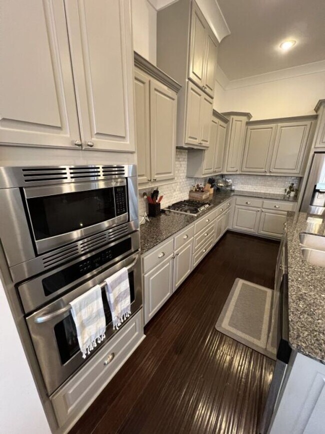 Building Photo - Luxury 4BR Home in Americana | 11 Ft Ceilings, Courtyard Living & Furnished Option at $3,950