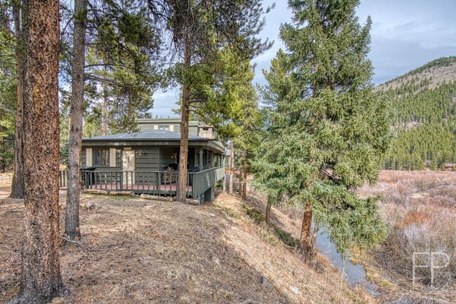 Building Photo - On the Blue River!  HUGE 4 Bedroom home, Furnished Updates throughout!  Bus route!  Spacious parking
