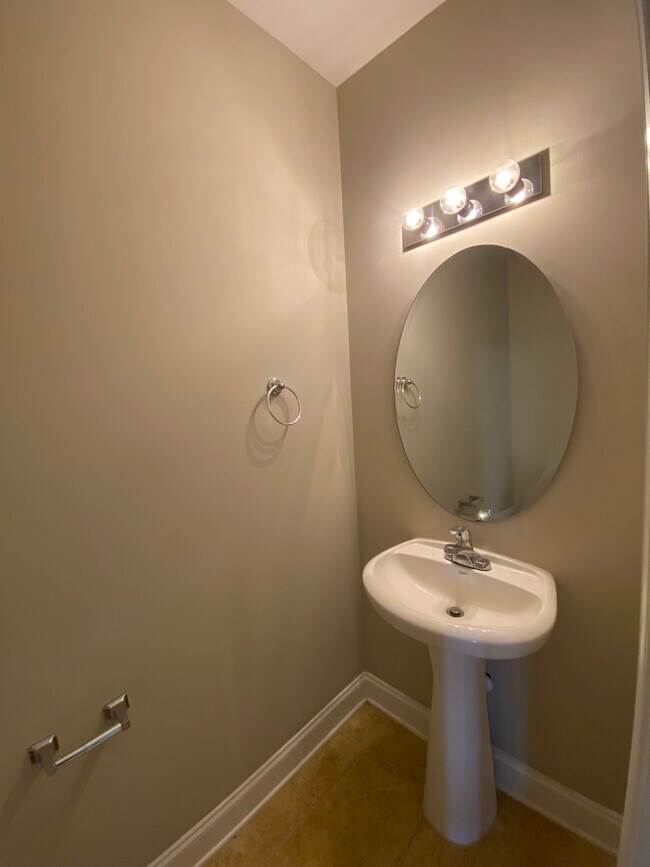 Downstairs half bath, right off the kitchen. - 137 High Ridge Rd