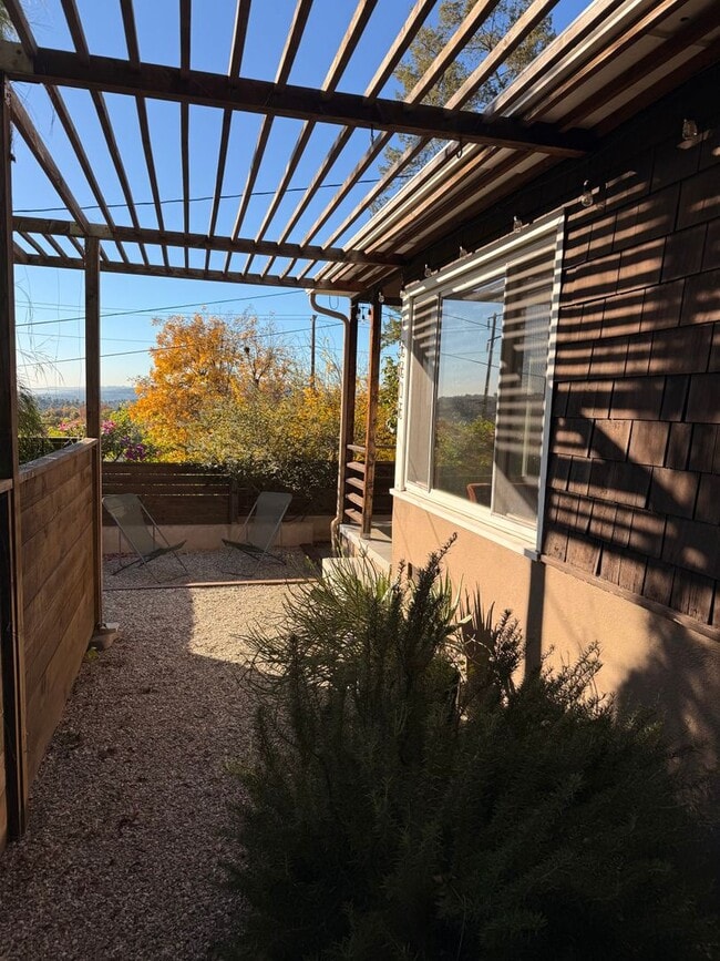 Building Photo - Hilltop Highland Park Sanctuary with Views, Private Gated Yard, In Unit Laundry, Parking & Abunda...