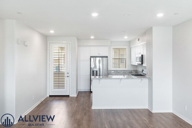 Building Photo - Modern Tri-Level Townhome with Office, 2-Car Garage & Prime Anaheim Location!