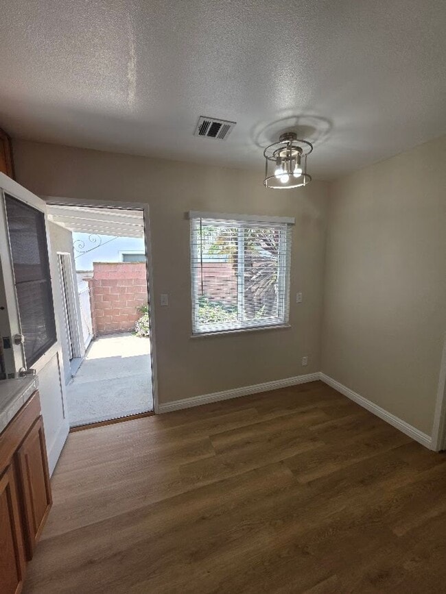 Building Photo - TURNKEY-RENT READY SPACIOUS 2BD/2BA HOME, 2-CAR GARAGE WITH AN AUTOMATIC ROLL-UP DOOR, LARGE COVE...
