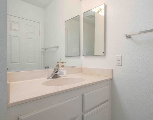 Building Photo - Gated Townhome with Updated Kitchen and Private Backyard