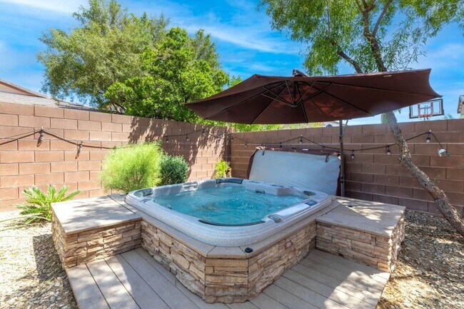 Building Photo - Spacious Mountain’s Edge Home with Den, Sunroom, 3-Car Garage & Private Spa Retreat