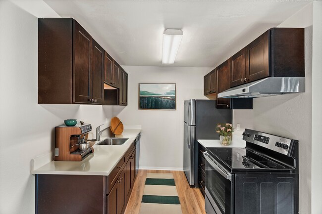 Step into a kitchen where sophistication meets functionality. - University Crossing Apartments