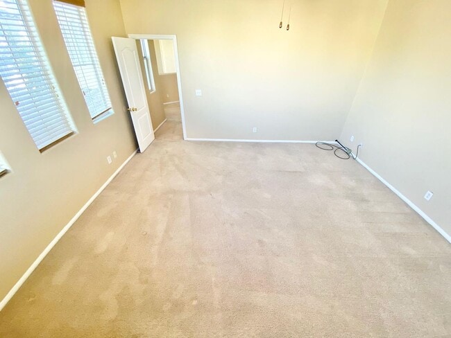 Building Photo - THIS SPACIOUS RESIDENCE FEATURES 4 BEDROOM...
