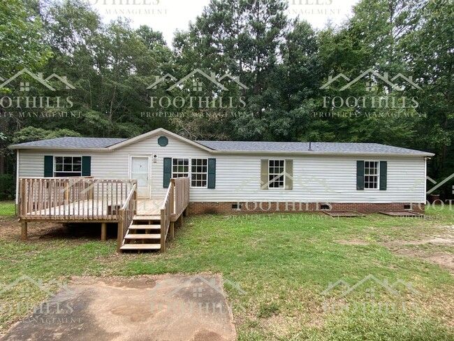 Primary Photo - Spacious 4-Bedroom Double-Wide Mobile Home...