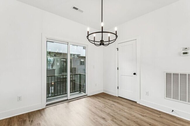 Building Photo - High-End 2BR Townhome | Rooftop Terrace + 2-Car Garage | 24-Unit Commnity