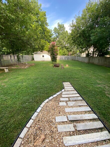 Fenced in back yard with garden & fire pit - 1310 N Clay Ave