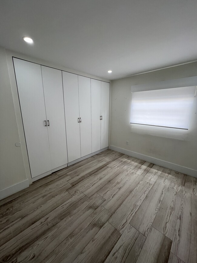 Bedroom 2 with custom closet space - 4600 SW 67th Ave