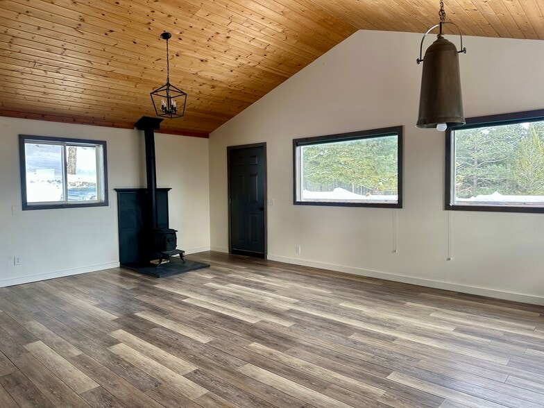 Living room with wood burning stove - 1150 Hidden Ranch Rd