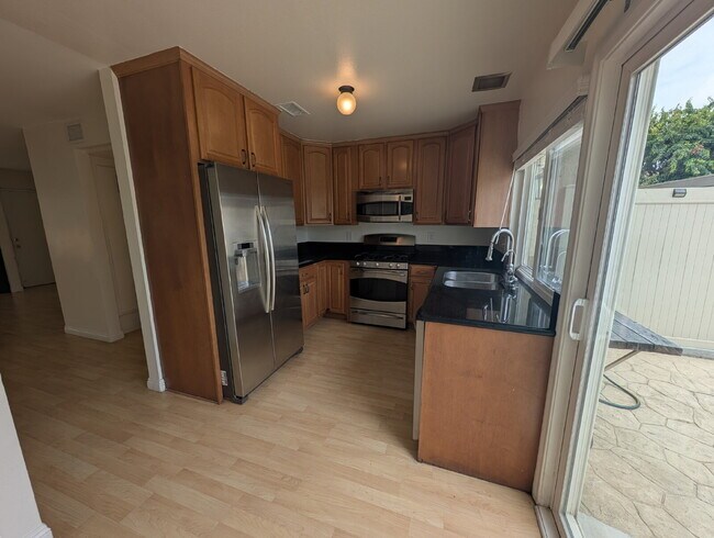 Building Photo - MOVE-IN READY - SPACIOUS 2-BEDROOM TOWNHOM...