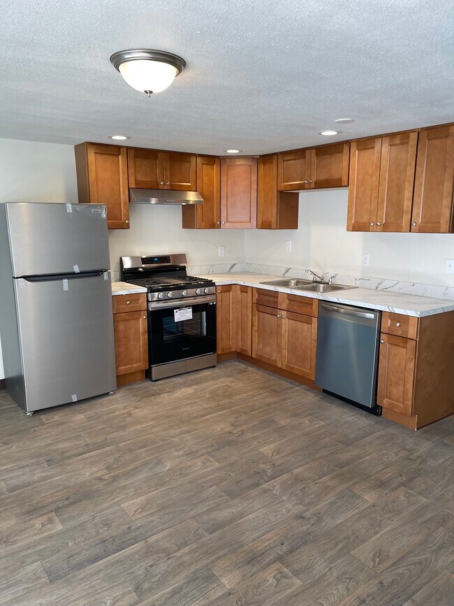 Stainless refrigerator - 1805 NE Hillaire Ct