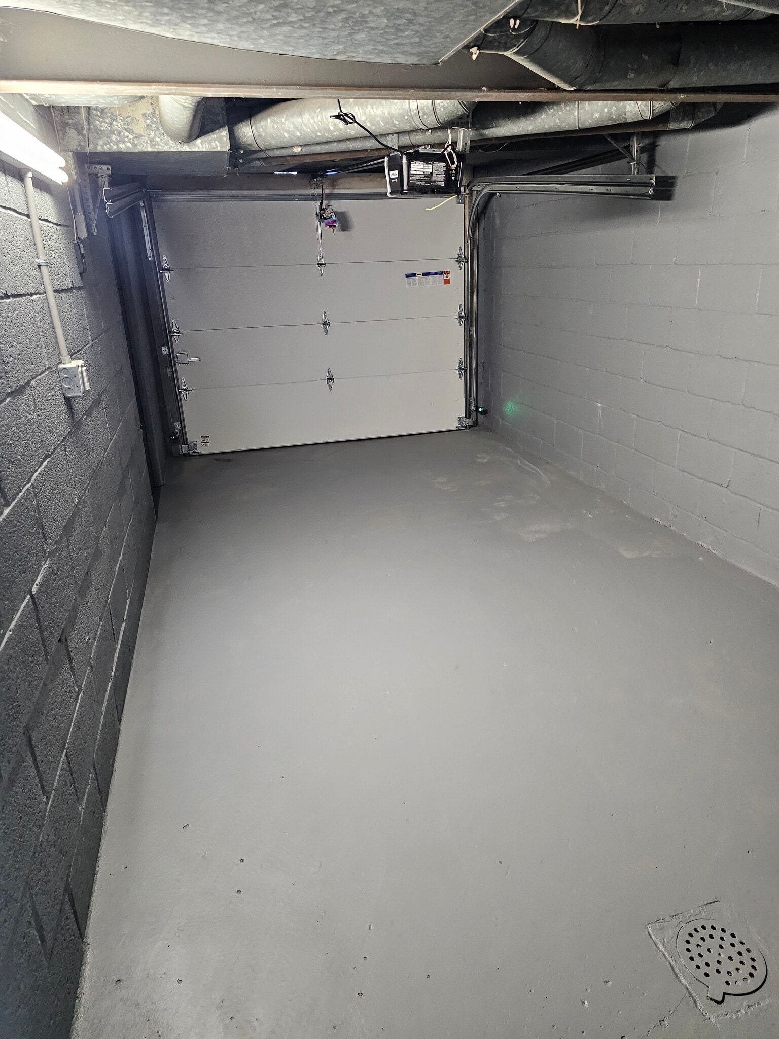 Brand new automatic garage door and freshly painted floor and walls - 4355 Coleridge St