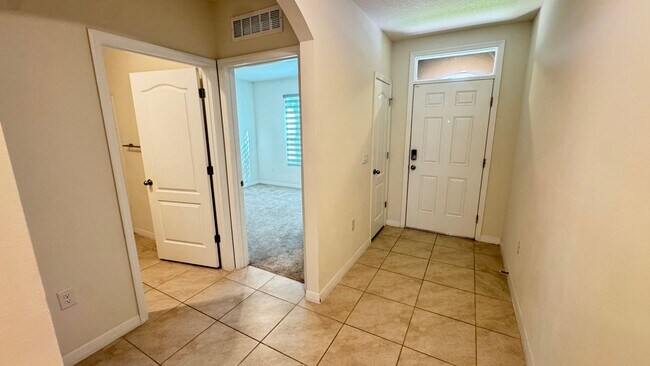 Building Photo - Available NOW! Spacious 4BD/2BA Haven in Villages at Harmony – Your Dream Home Awaits! WASHER & D...