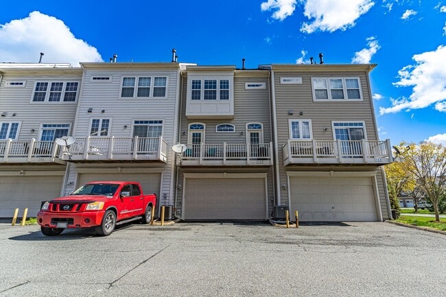 Building Photo - Belmont Bay Beauty! Three level two car ga...