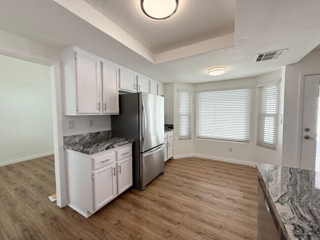 Building Photo - Corner Lot Beauty with Open Living, Guest Suite Down & Expansive Backyard