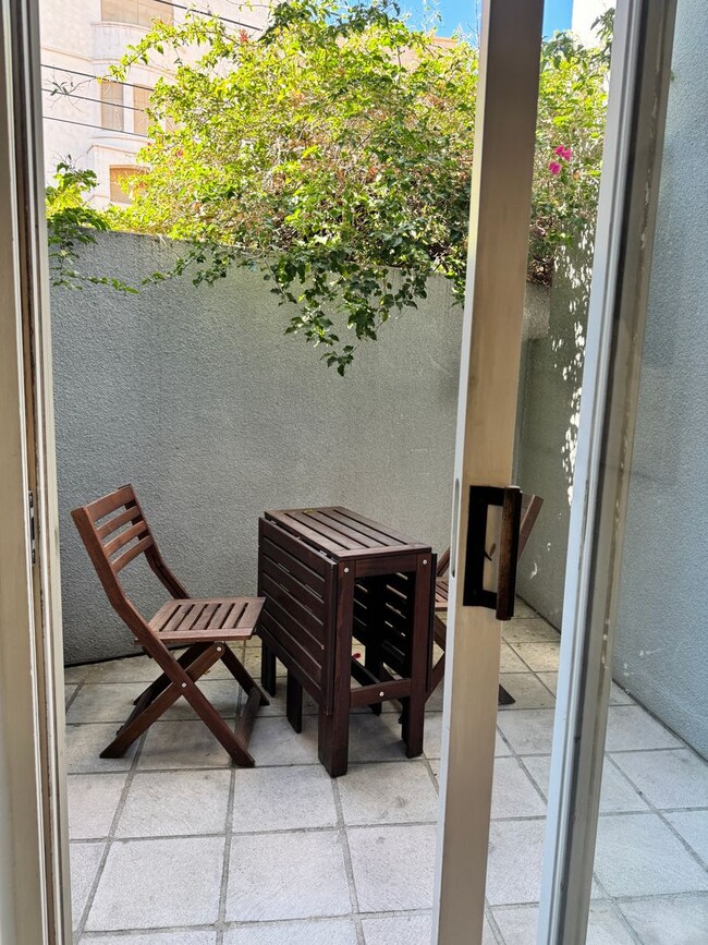 Building Photo - Charming Condo with Two Patios! Steps to t...