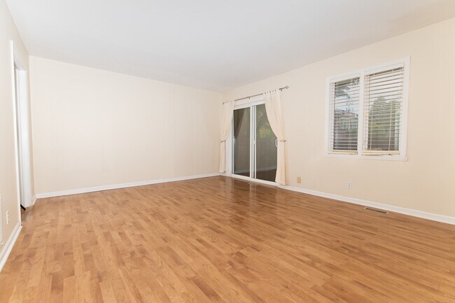Large living room with room for a couch, chairs, and a big screen TV - 8508 Canterbury Sq E
