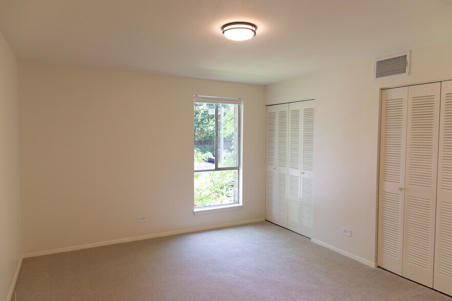 Primary bedroom with 12' of closet space - 511 1st St N