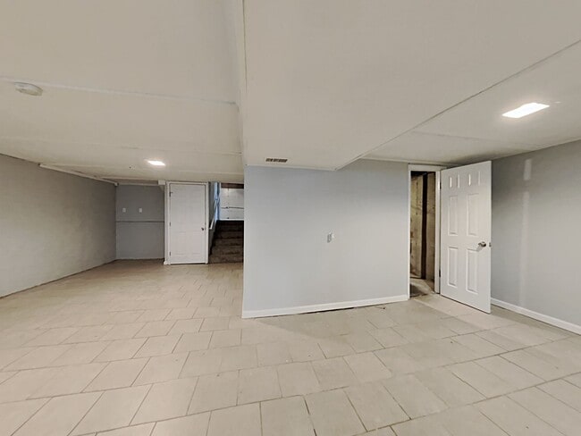 Building Photo - Spacious 4BR Home with Finished Basement, Fireplace & Unique Layout