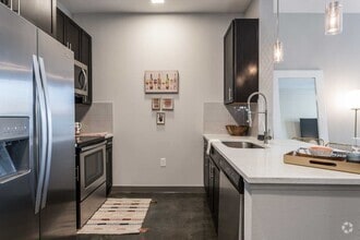 Building Photo - Your Downtown Lifestyle Begins Now
