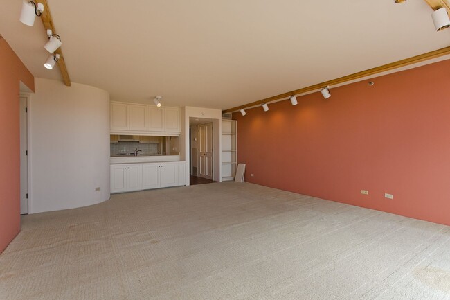 Building Photo - Royal Iolani Corner Unit - 2 PRK w/ ALL Ut...