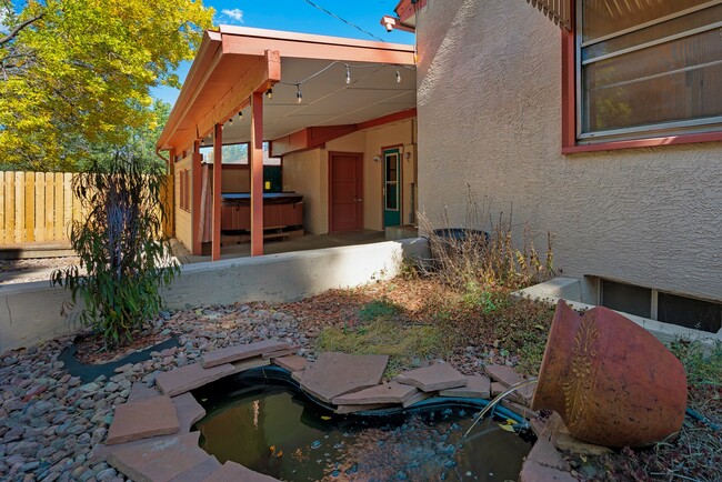 Side view into covered outdoor eating/BBQ/Hot tub area. - 114 N Foote Ave