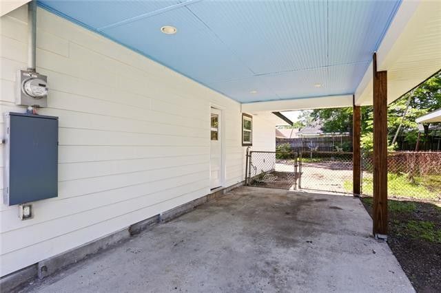 Carport parking and driveway can accommodate up to three cars. - 413 River Oaks Dr
