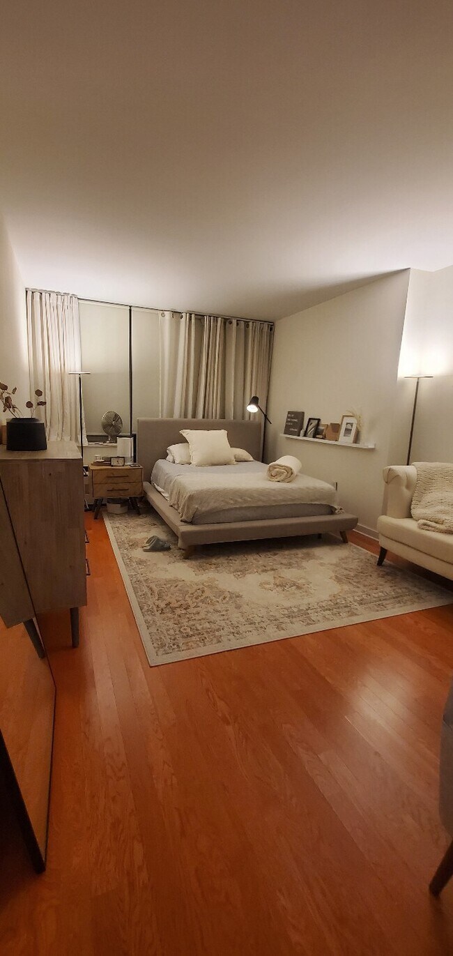 fully furnished bedroom with queen size bed - 317 Hudson Park