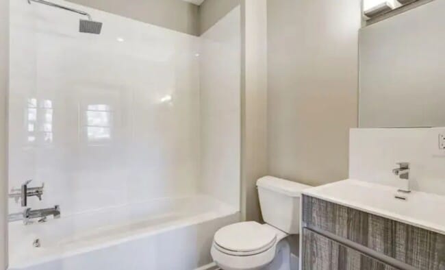 Building Photo - “Elegant 3-Story Home Showcasing High-End Renovation, Gourmet Kitchen, and Private Deck for Moder...