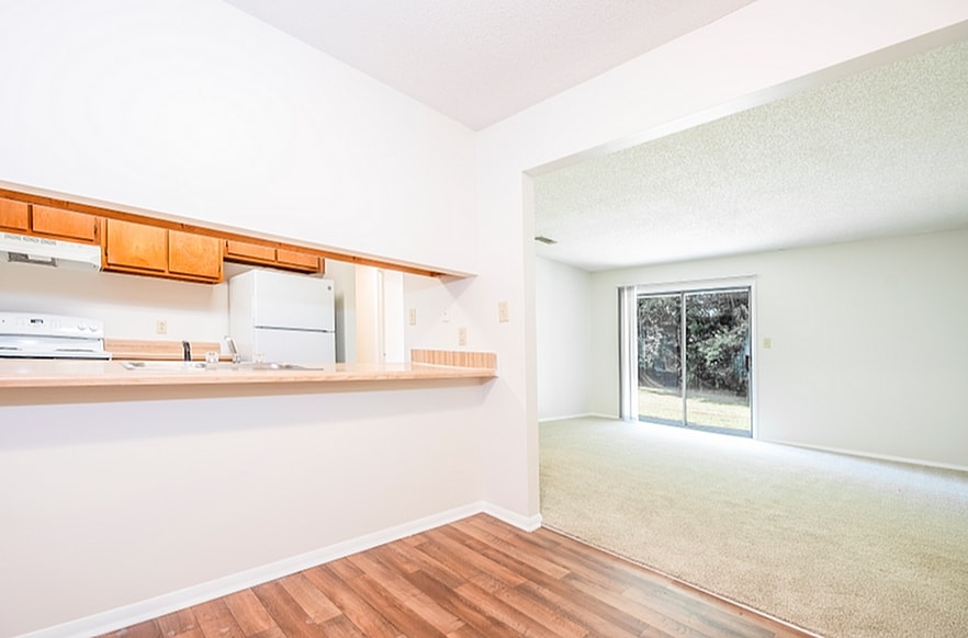 Experience the blend of style and comfort in this open-concept living area. - Corder Crossing