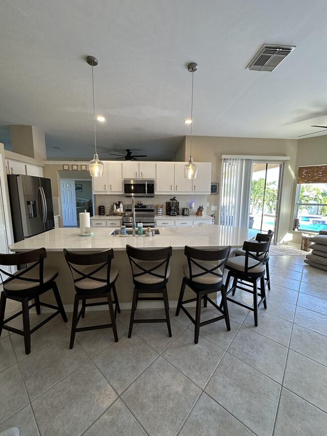 Large kitchen with granite counter tops and stainless steel appliances - 1305 SW 11th Plz