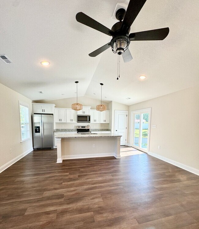 Building Photo - BEAUTIFUL pond front home! All the details make this a showstopper.! Fenced Yard!!