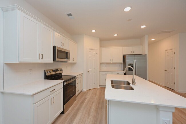 Building Photo - **BE THE LUCKY ONE TO LIVE IN THIS 2024-BUILT BRICK TOWNHOME IN THE VILLAS AT REGAL SQUARE FEATUR...