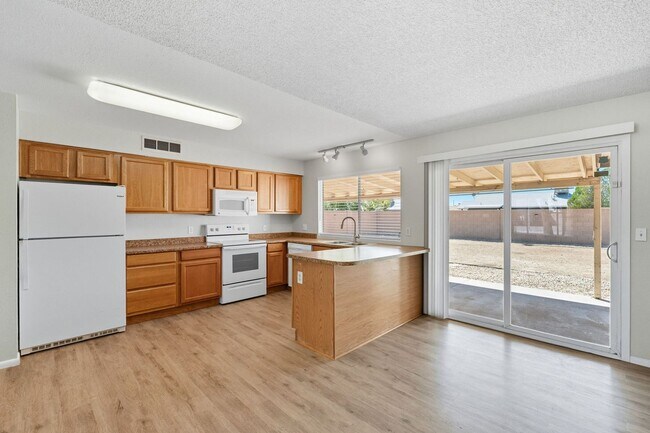 Building Photo - Three bedrooms plus big garage!