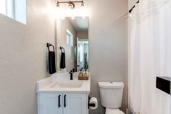 Second bedroom ensuite full bath - 8500 W 62nd Ave