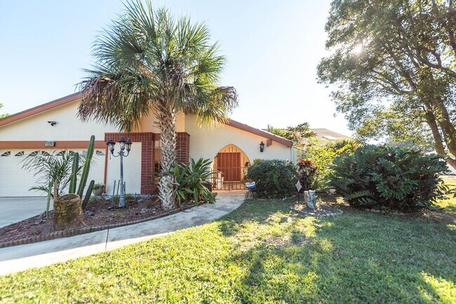 Building Photo - Welcome to this spacious three-bedroom, three-bath home in the heart of Palm Bay