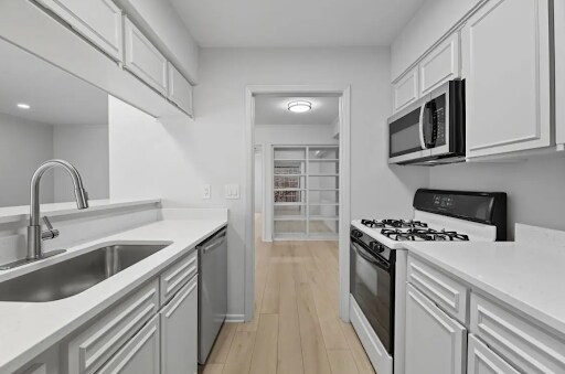 Remodeled kitchen with pantry. - 7920 Rockwood Ln