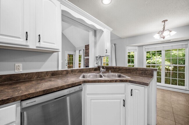 Building Photo - Stunning Stone Fireplace • Finished Basement • Fenced Yard