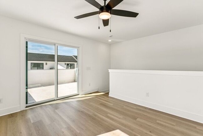 Building Photo - High-End 2BR Townhome | Rooftop Terrace + 2-Car Garage | 24-Unit Community