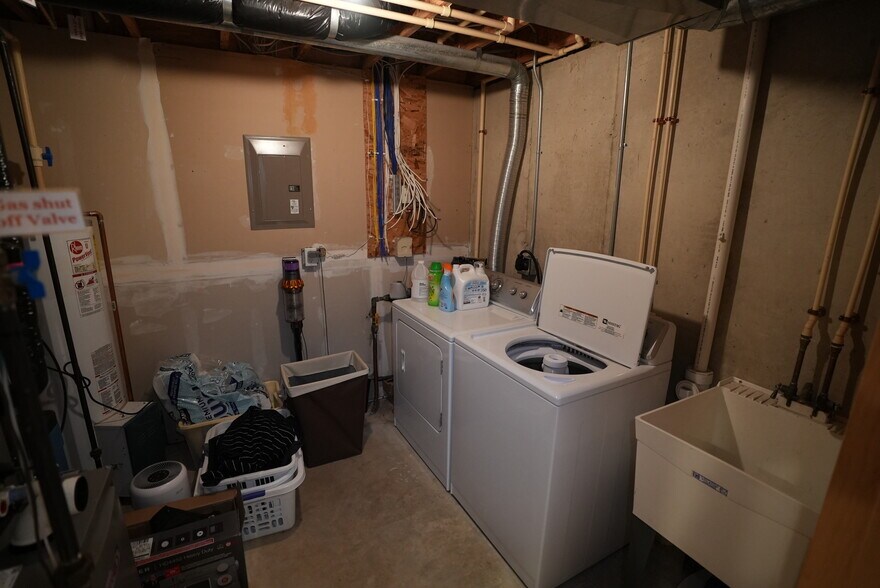 Laundry room with unit washer and dryer - 54 Wood Brook Way