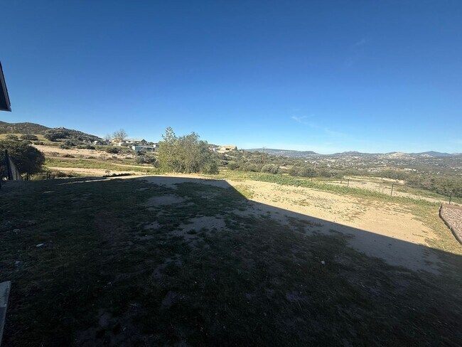 Building Photo - 4BR/2BA HOME w/ attached garage, usable land, fenced in back yard in CAMPO available!