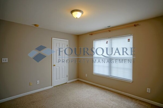 Building Photo - Townhome | 2nd Bedroom Features an En-Suit...