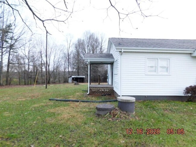 Building Photo - Home with 2 bedrooms, 1 bath, side deck, carport with side porch and detached garage