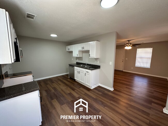 Building Photo - Spacious 4BR/2BA Home in 38141 | Vinyl Flooring & Large Fenced Backyard