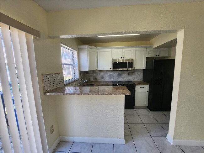 Building Photo - 2400 NW 52nd Ave